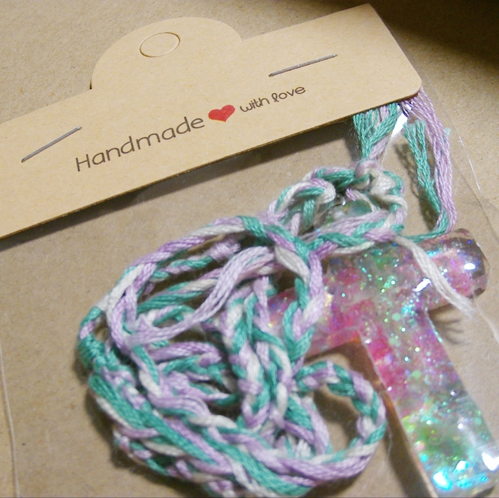 Easter themed cross with braided necklace cord